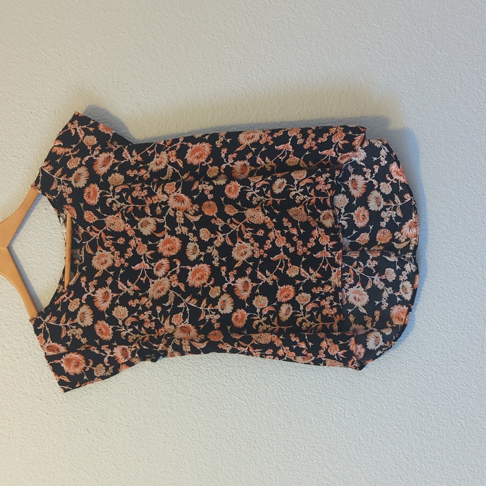 Orange flower design on black shirt